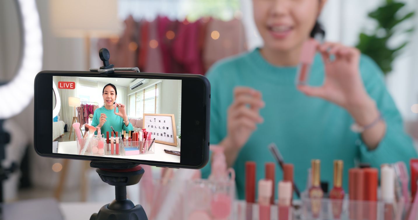 woman-influencer-live-video-camera-at-home-studio