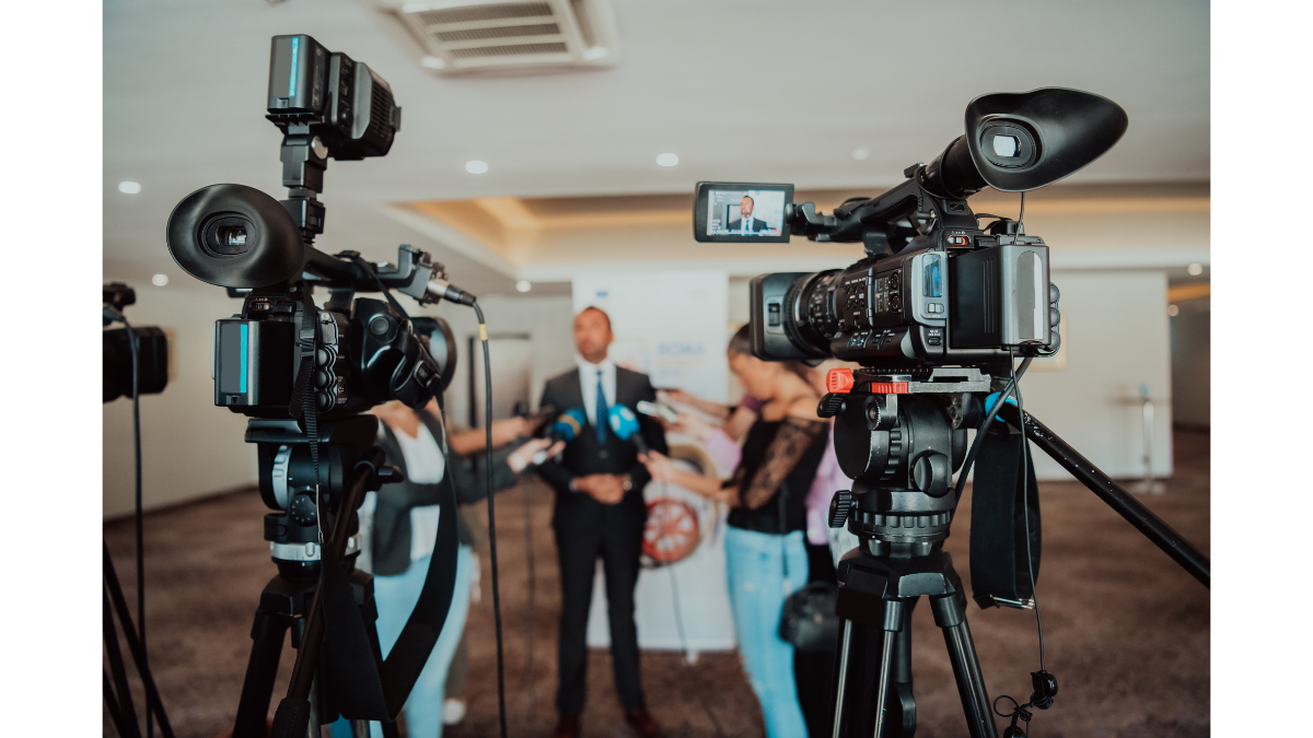 Professional cameras at a media event, representing advanced AI Cloud Photography and real-time data management solutions.