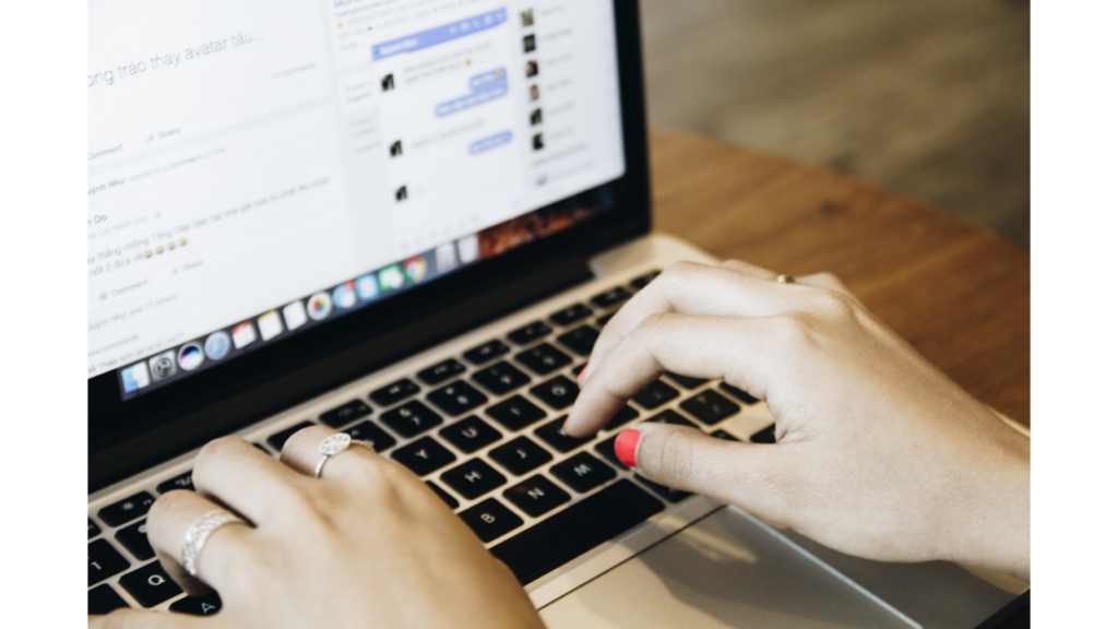 Person using a laptop with Facebook open, representing Facebook ad performance analysis, campaign optimization, audience targeting, and improving advertising ROI.