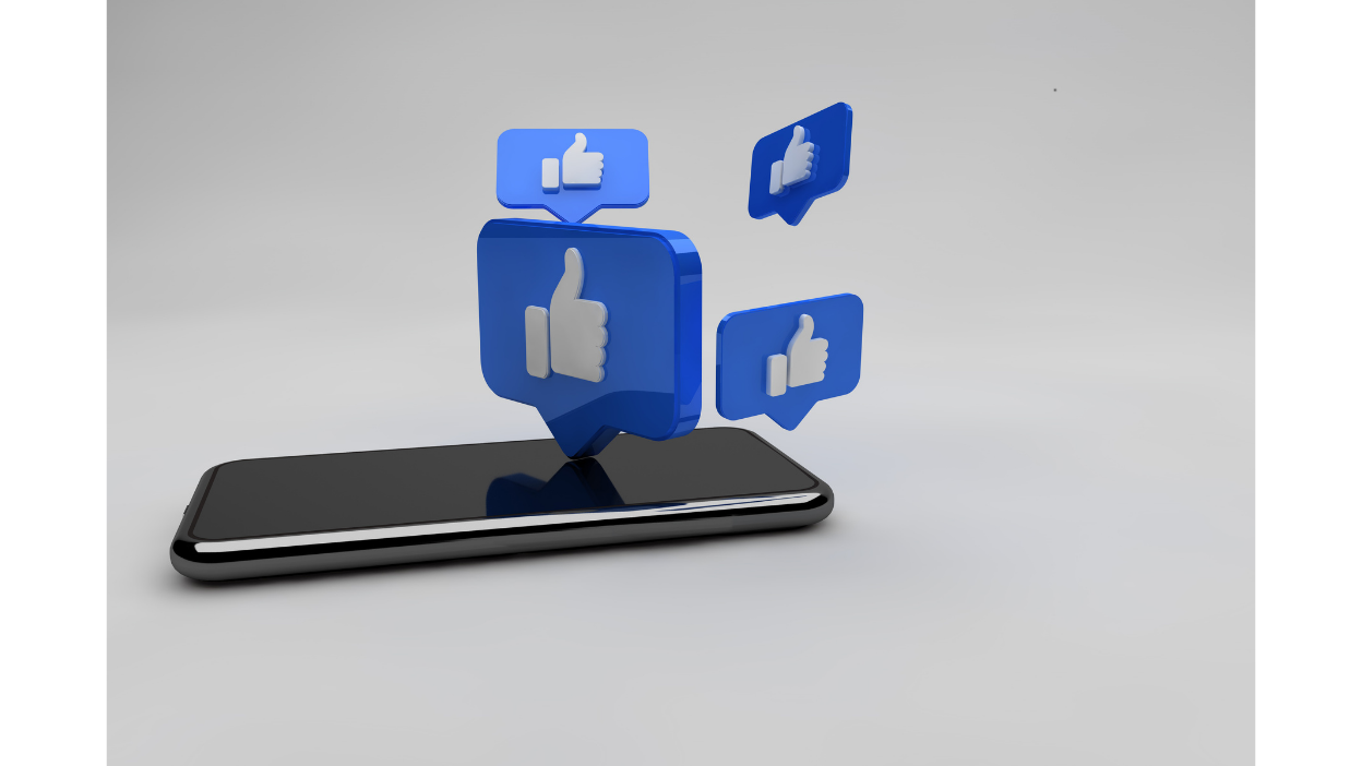 Smartphone displaying floating Facebook like icons, symbolizing Facebook advertising, campaign performance, user engagement, and digital marketing success.