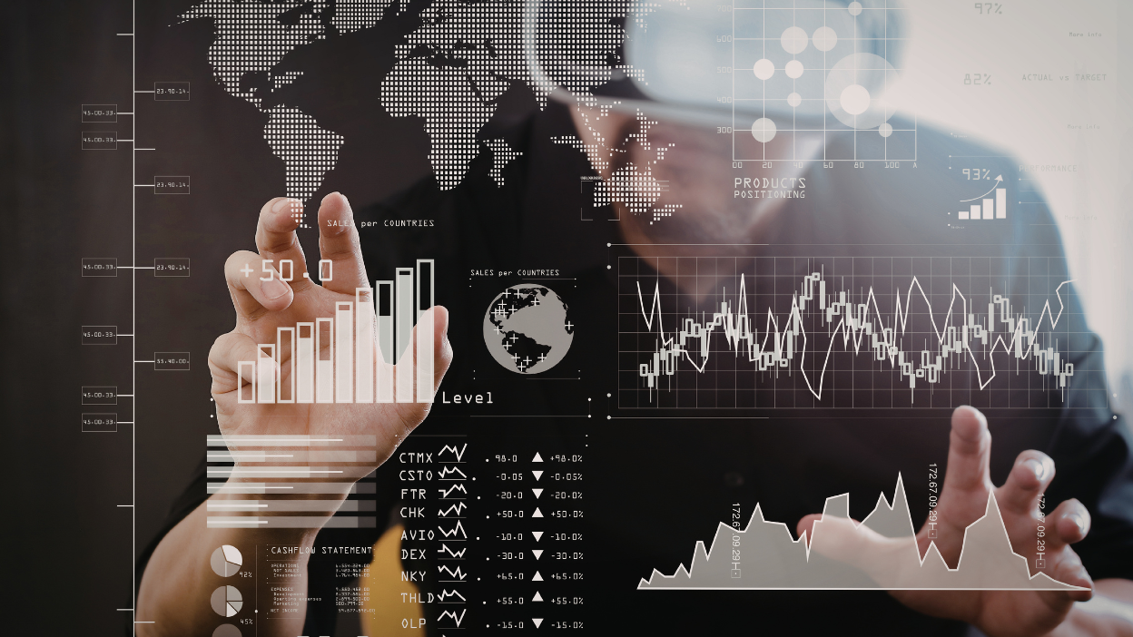 Business professional analyzing digital marketing analytics dashboard with global data visualization, representing MarTech (Marketing Technology), marketing automation, and data-driven marketing strategy.
