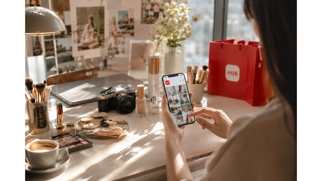 highly realistic editorial-style visual for a premium social media branding campaign inspired by Xiaohongshu (RED). The scene should represent the concept of “visual storytelling” in a modern Chinese social media ecosystem