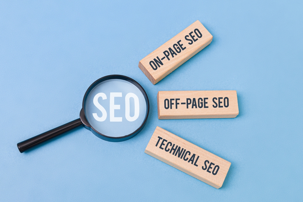 Three wooden blocks labeled "On-Page SEO," "Off-Page SEO," "Technical SEO"
