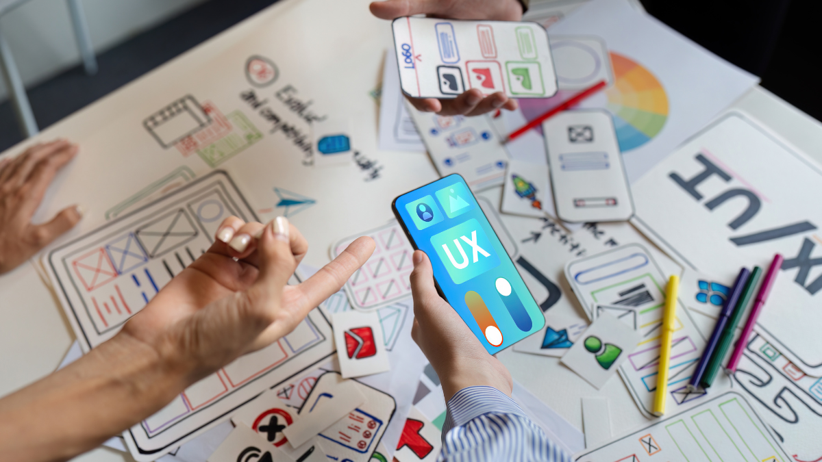 ux developer and UI designer team brainstorm together about designing application interface layout. Creative digital development agency. UX UI conceptv